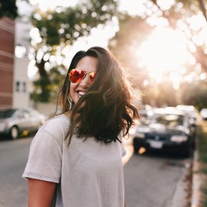 woman smiling in the street