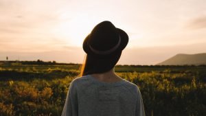 girl looking at sunset